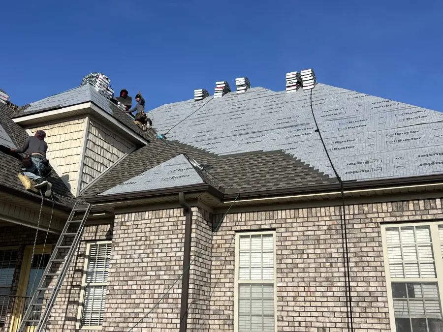 IMPACT crew installing GAF FeltBuster underlayment